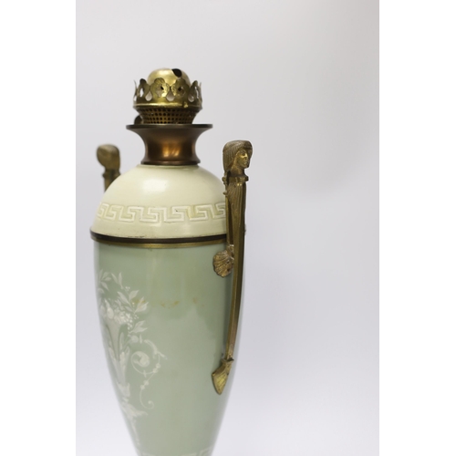 1402 - A late 19th century pate sur pate and gilt metal oil lamp with twin handles (restoration), 44cm... 