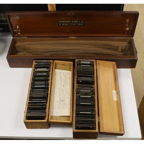 1422 - Two boxed sets of photographic magic lantern slides including military and a mahogany cased collecti... 