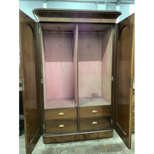 11 - A Victorian walnut two door wardrobe, width 140cm, depth 70cm, height 214cm