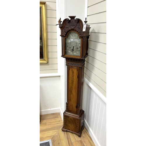 156 - A 1920's George III style mahogany grandmother clock with arched silvered dial and three train movem... 