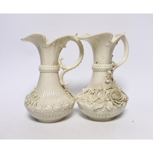 373 - A pair of Belleek jugs with applied rose decoration, 19 cm high