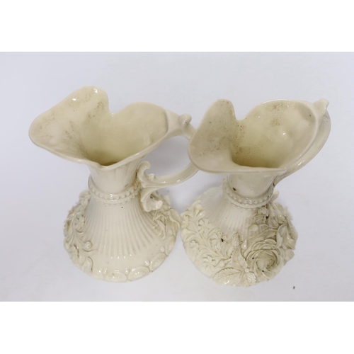 373 - A pair of Belleek jugs with applied rose decoration, 19 cm high