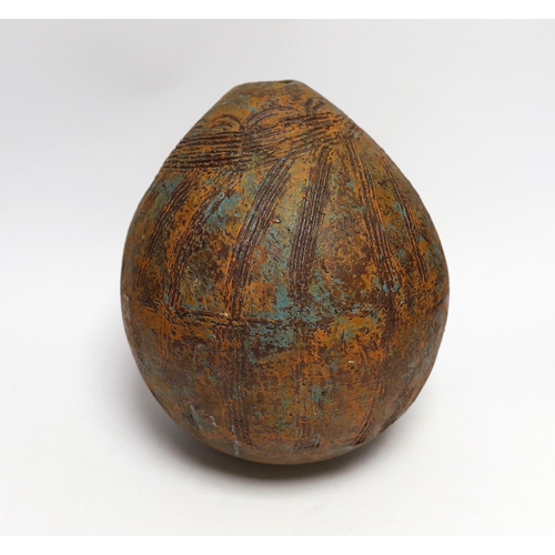 395 - A Pre-Columbian style ovoid earthenware vase, 26cm high