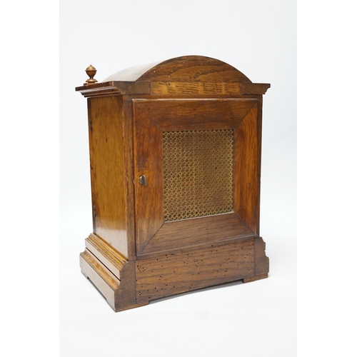 397 - An Edwardian carved oak mantel clock with engraved dial, 33cm high