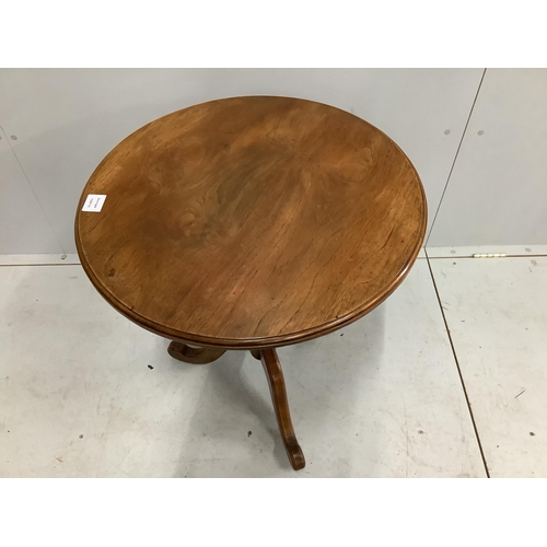 40 - A Victorian style circular walnut tripod wine table, diameter 60cm, height 69cm