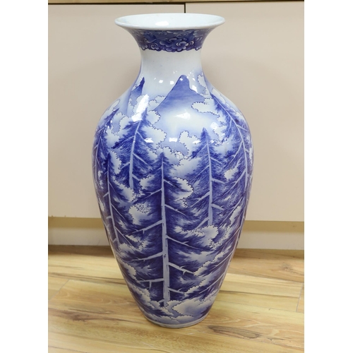 406 - A large Japanese Arita blue and white vase, late 19th century, decorated with pine trees and mountai... 