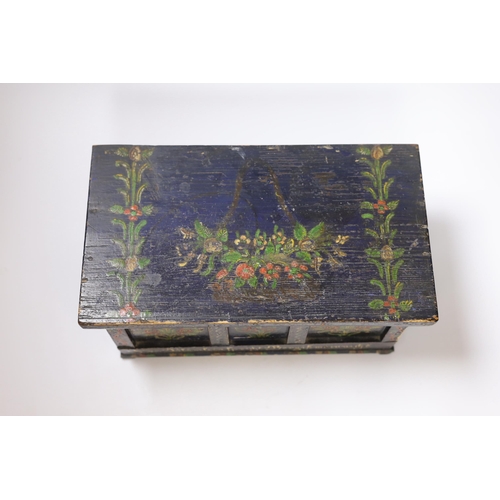 434 - A 19th century German or Austrian floral painted pine casket, 32cm wide