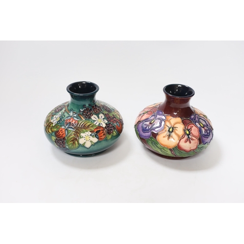 446 - Two small Moorcroft squat vases, in Pansy and Carousel patterns, 10.5cm