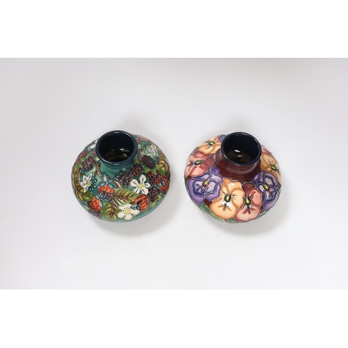 446 - Two small Moorcroft squat vases, in Pansy and Carousel patterns, 10.5cm