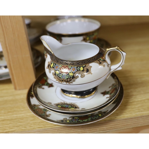 460 - A Japanese Noritake floral and gilt tea set, comprising a sugar bowl, a milk jug, nine cups, plus sa... 