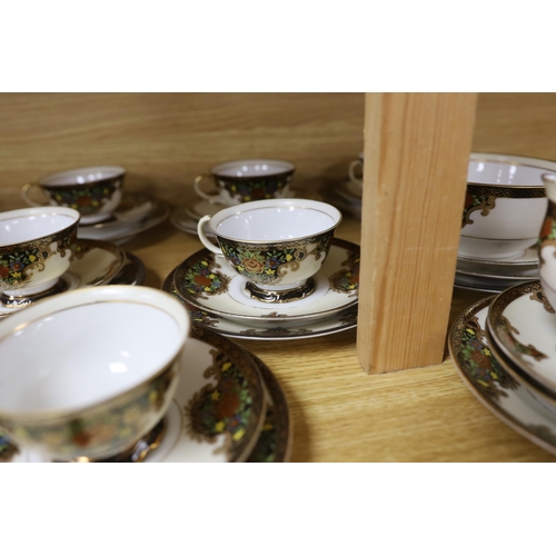 460 - A Japanese Noritake floral and gilt tea set, comprising a sugar bowl, a milk jug, nine cups, plus sa... 