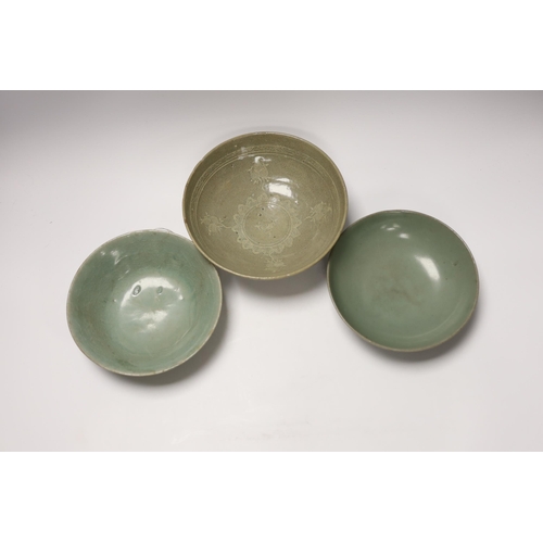 499 - Two Korean celadon bowls, Goryeo dynasty (11th/12th century), the first carved with lotus petals to ... 