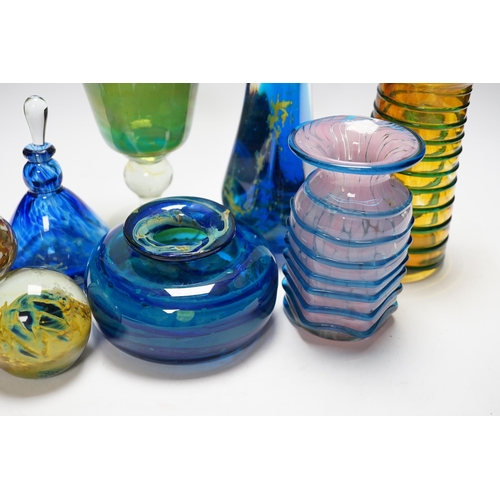 515 - A group of Mdina glass comprising three vases, a stemmed glass, three paper weights and a scent bott... 