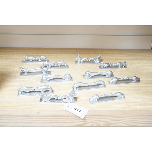 517 - A set of 12 French pewter novelty knife rests, in the form of squirrels, fish, snails, goats, etc.... 