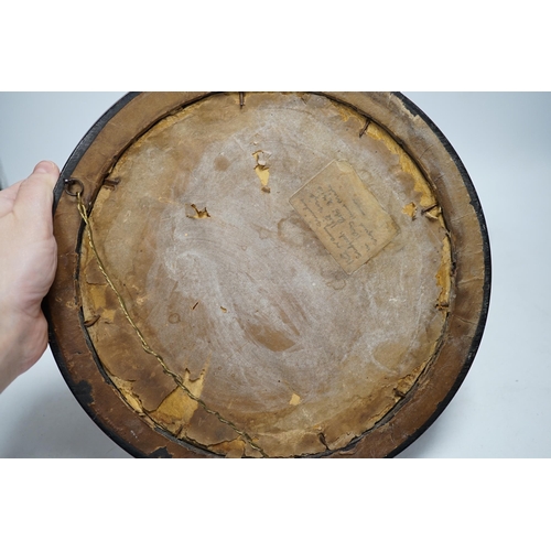 518 - An Arts and Crafts brass and copper roundel, in the manner of Archibald Knox, monogrammed CA, ebony ... 