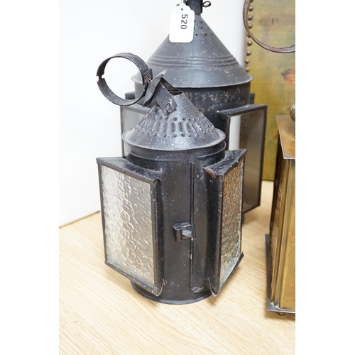 520 - Three 19th century candle lanterns, one brass 45cm high, two black painted steel 45cm & 35cm high... 