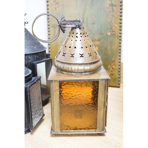 520 - Three 19th century candle lanterns, one brass 45cm high, two black painted steel 45cm & 35cm high... 