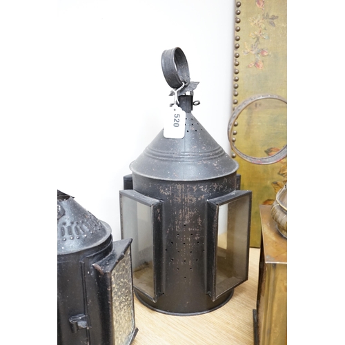 520 - Three 19th century candle lanterns, one brass 45cm high, two black painted steel 45cm & 35cm high... 