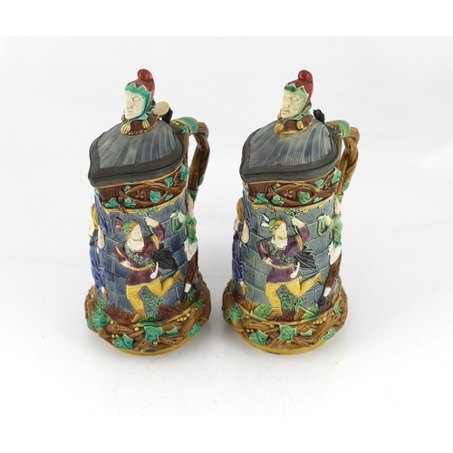 523 - A pair of Victorian Minton majolica Tower jugs, 33cm high