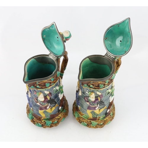 523 - A pair of Victorian Minton majolica Tower jugs, 33cm high