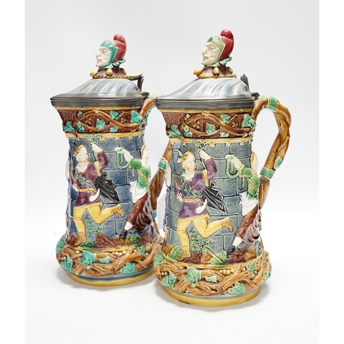 523 - A pair of Victorian Minton majolica Tower jugs, 33cm high