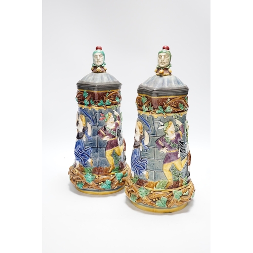 523 - A pair of Victorian Minton majolica Tower jugs, 33cm high