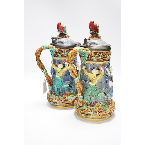 523 - A pair of Victorian Minton majolica Tower jugs, 33cm high