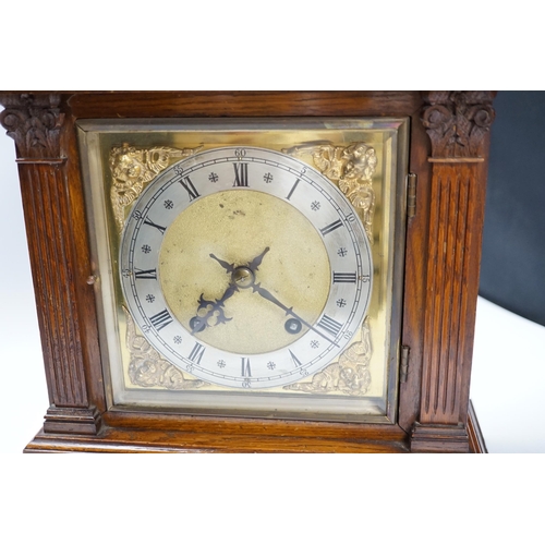 528 - Victorian oak mantel clock, brass dial and mask spandrels; Winterhalder & Hoftmier two train movemen... 