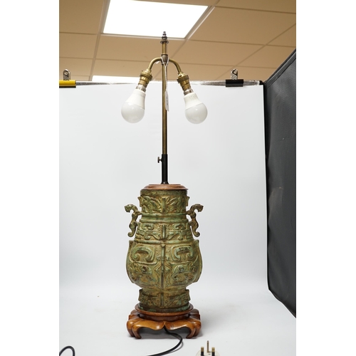 529 - A Chinese archaistic bronze table lamp on stand 36cm high