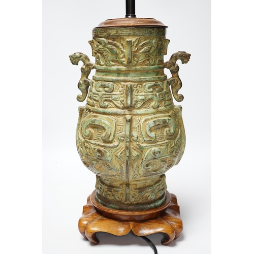 529 - A Chinese archaistic bronze table lamp on stand 36cm high