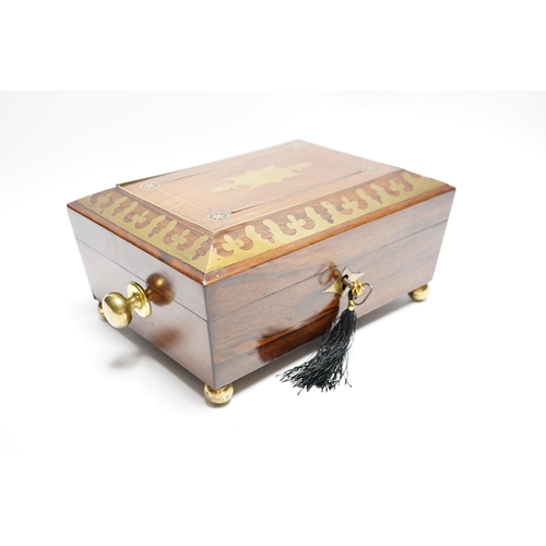 554 - A George IV rosewood and cut brass sewing box with fitted interior, cotton reels, thread and sewing ... 