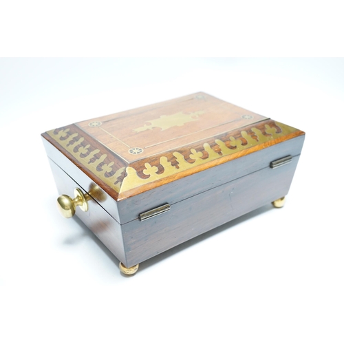 554 - A George IV rosewood and cut brass sewing box with fitted interior, cotton reels, thread and sewing ... 