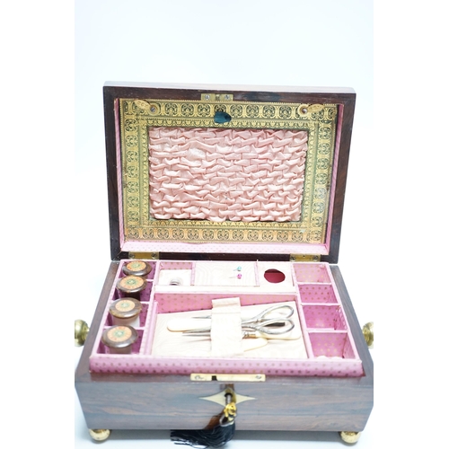 554 - A George IV rosewood and cut brass sewing box with fitted interior, cotton reels, thread and sewing ... 