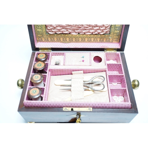 554 - A George IV rosewood and cut brass sewing box with fitted interior, cotton reels, thread and sewing ... 