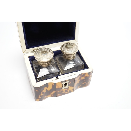 558 - A Victorian tortoiseshell cased pair of glass scent bottles with white metal lids, 9.5cm, CITES Subm... 