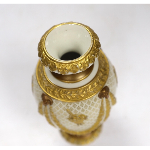 561 - An early 20th century Wedgwood Adam style small gilt porcelain vase, 15cm