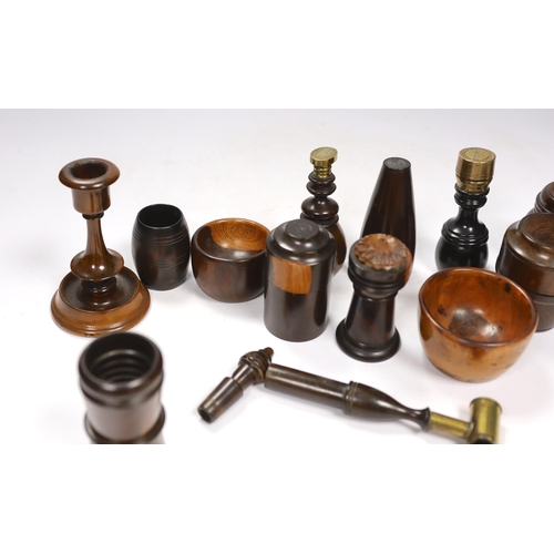 563 - A collection of 19th/20th century lignum vitae vessels and desk items, to include a pepper pot, salt... 