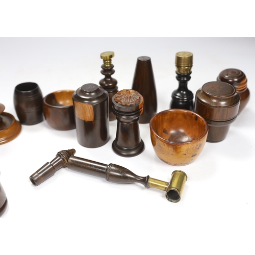 563 - A collection of 19th/20th century lignum vitae vessels and desk items, to include a pepper pot, salt... 