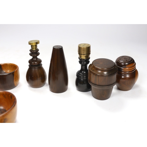 563 - A collection of 19th/20th century lignum vitae vessels and desk items, to include a pepper pot, salt... 