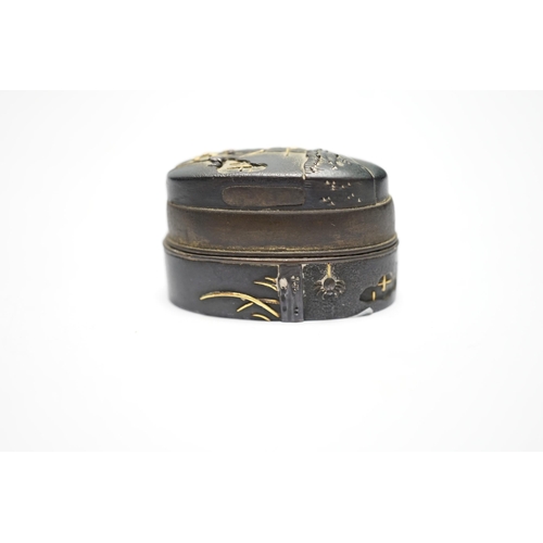 574 - A Japanese mixed metal and bronze box made from 19th century sword fittings, decorated with a spider... 