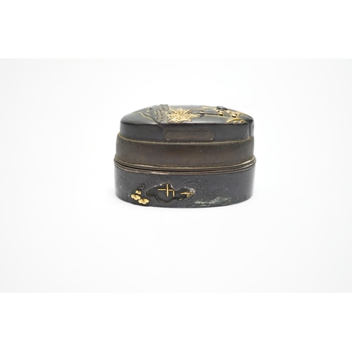 574 - A Japanese mixed metal and bronze box made from 19th century sword fittings, decorated with a spider... 