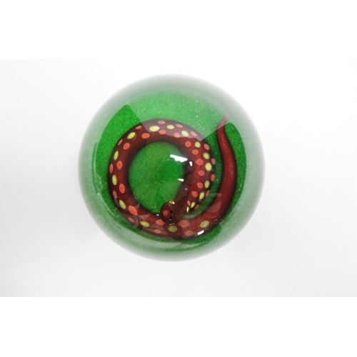 589 - A Paul Ysart aventurine snake glass paperweight, Harland period, PY cane beneath, green opaque g... 