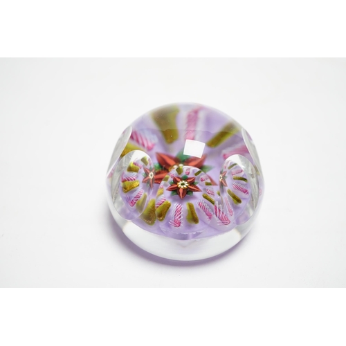 595 - A Paul Ysart faceted flower glass paperweight, Harland period, the central flower within aventurin... 