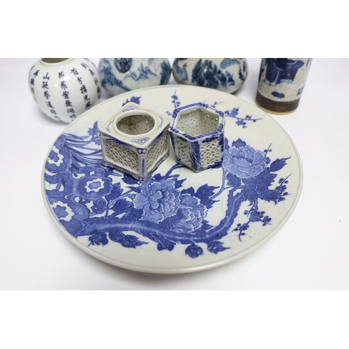 612 - A Japanese blue and white wall plate, a pair of Chinese jars and covers, cylindrical crackle glaze v... 