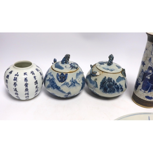 612 - A Japanese blue and white wall plate, a pair of Chinese jars and covers, cylindrical crackle glaze v... 