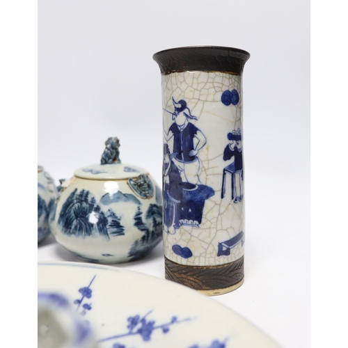 612 - A Japanese blue and white wall plate, a pair of Chinese jars and covers, cylindrical crackle glaze v... 