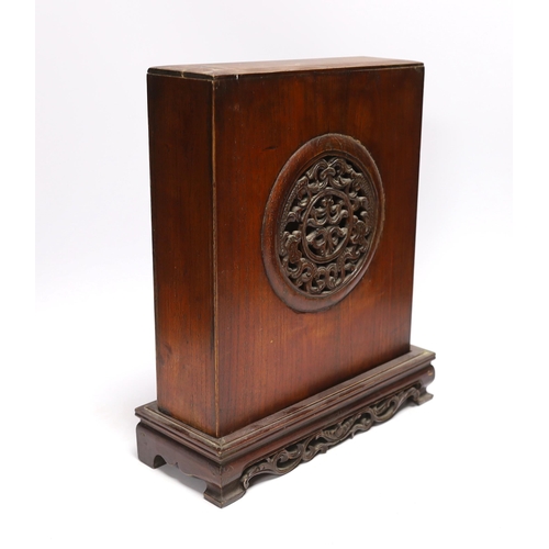 614 - A Buddhist domestic carved hardwood shrine, 34cm high