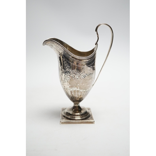 828 - A George III engraved silver helmet shaped cream jug, on square foot, Soloman Hougham, London, 1796,... 