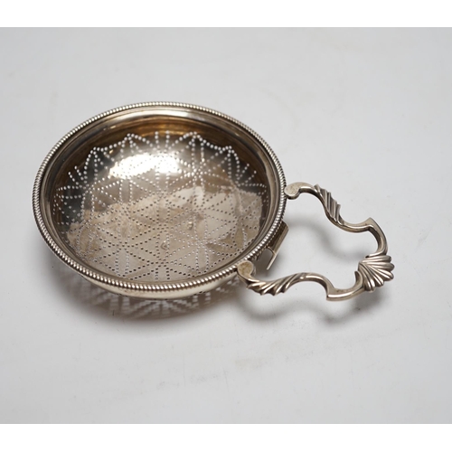 830 - A late George II silver lemon strainer, maker WS?, London, 1759?, 14.7cm.