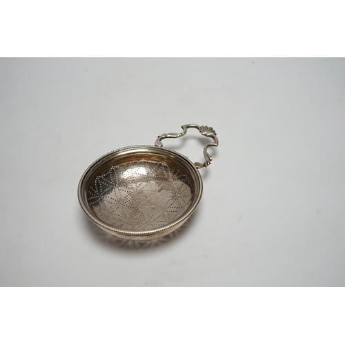 830 - A late George II silver lemon strainer, maker WS?, London, 1759?, 14.7cm.